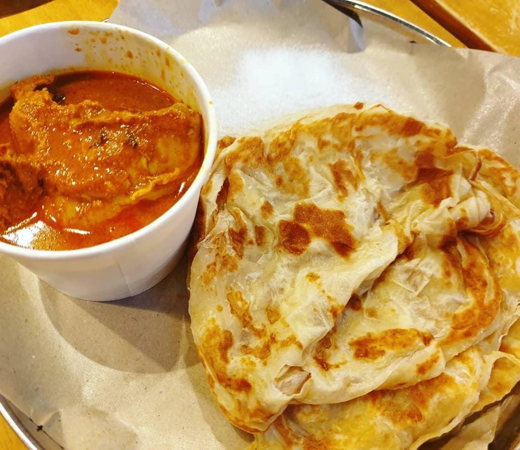 Singapore's crispy flatbread with fish curry called roti prata